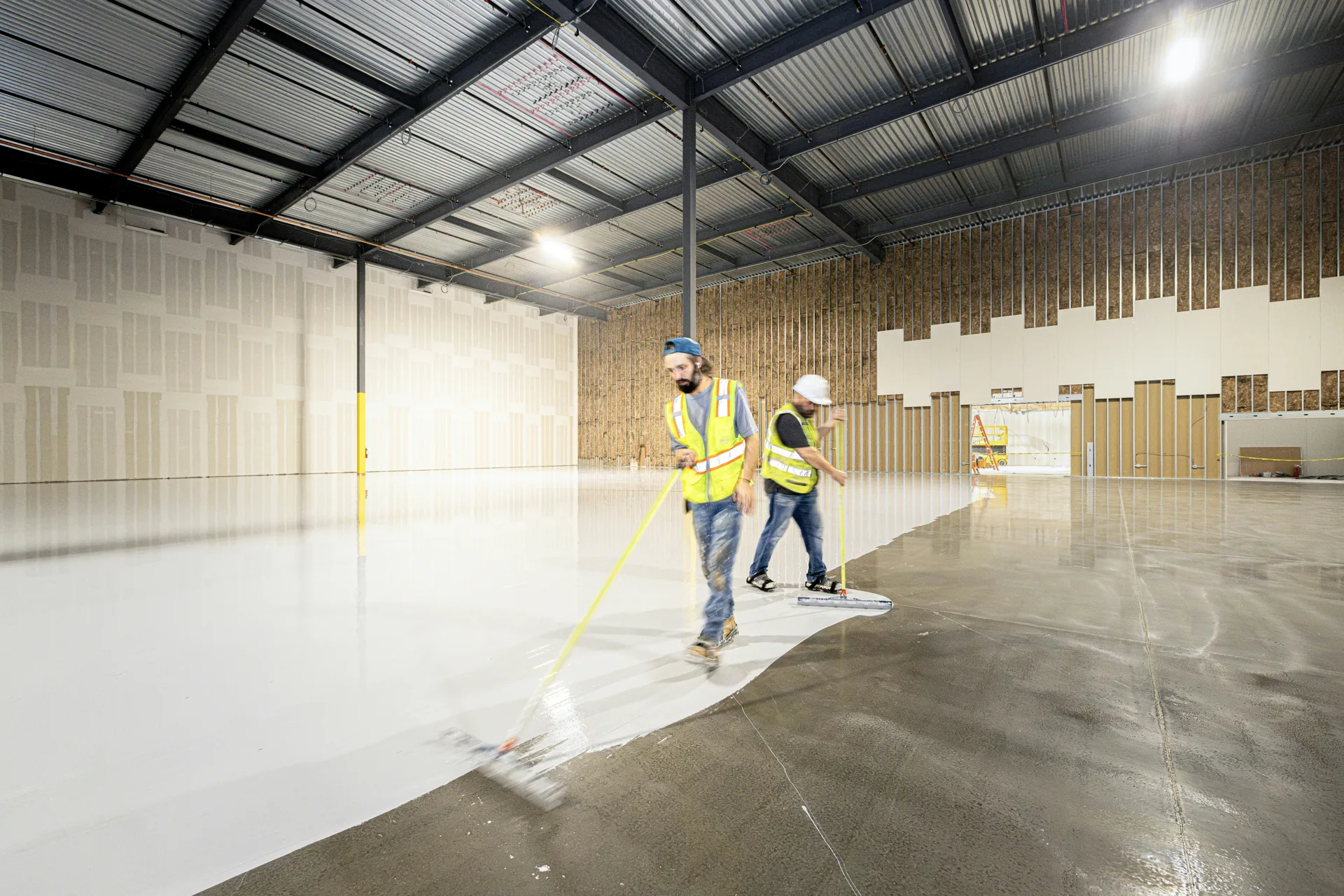 crew rolling epoxy onto a Las Vegas garage floor