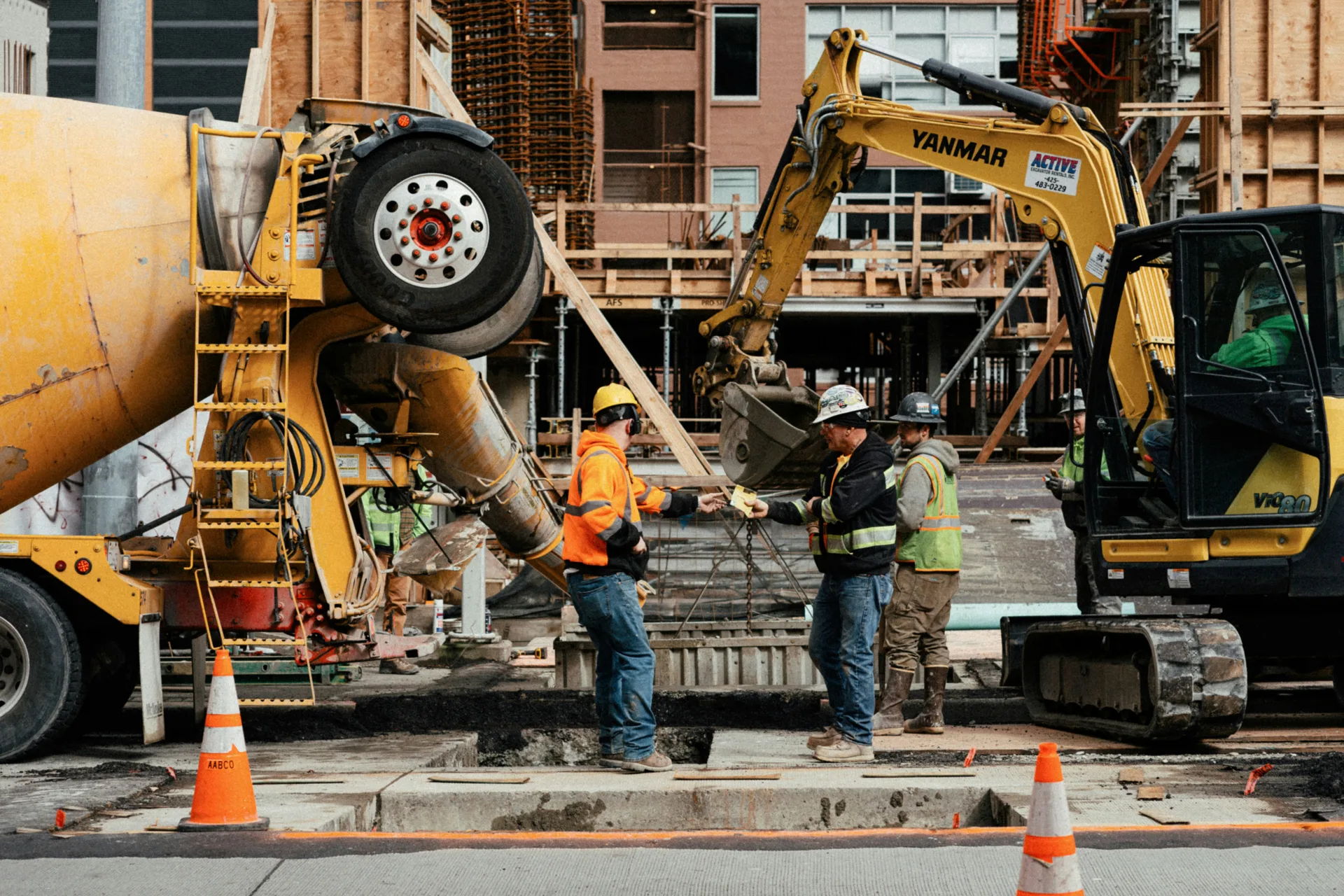 ready mix concrete pour on a Las Vegas urban site with a mini excavator