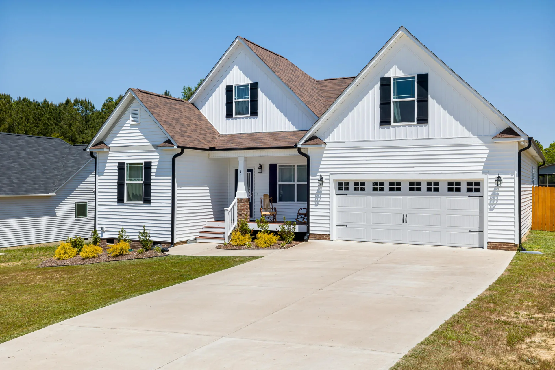 long concrete driveway at a Henderson acreage home with double garage