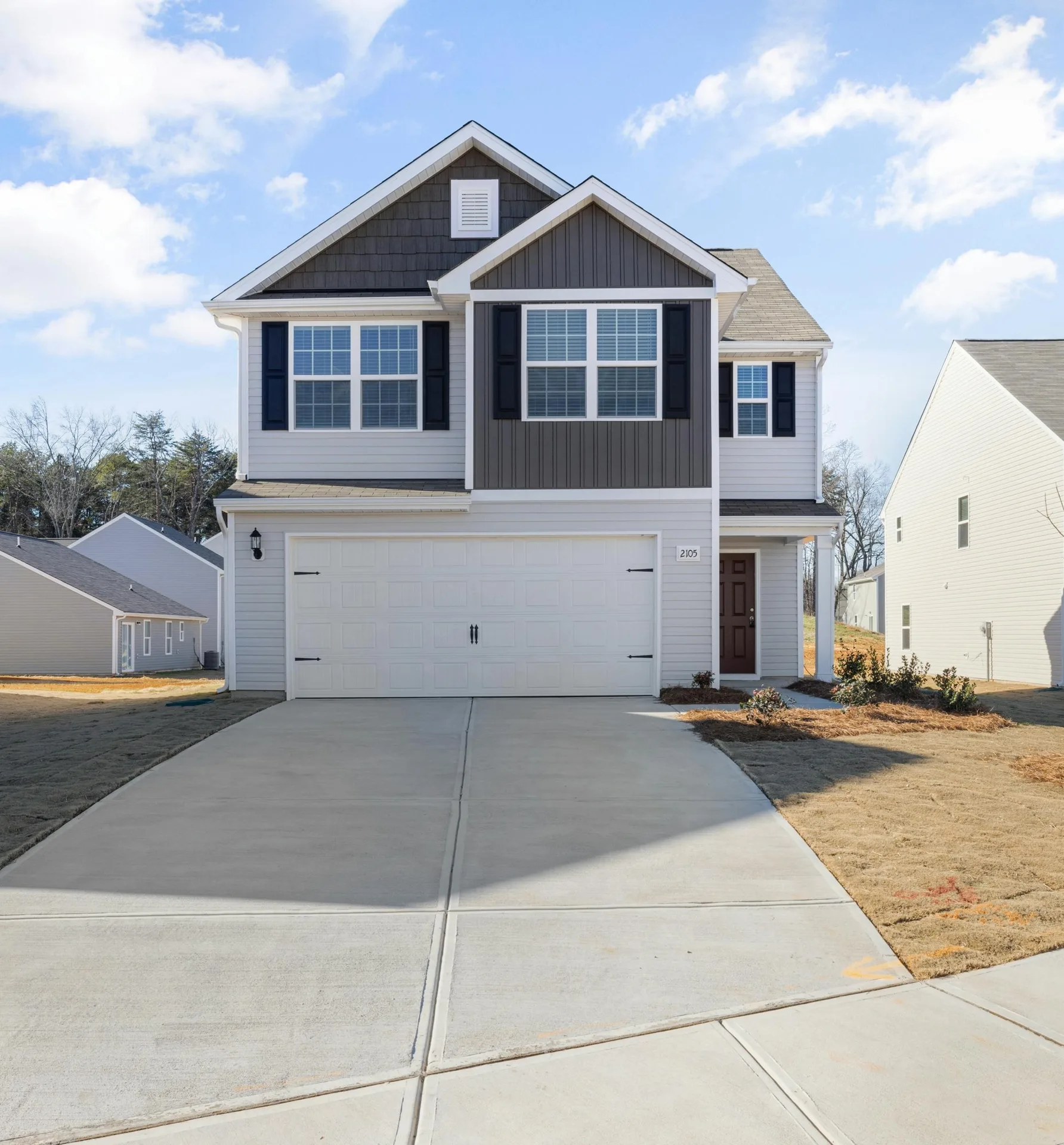 new concrete driveway at a grey new-build Las Vegas home