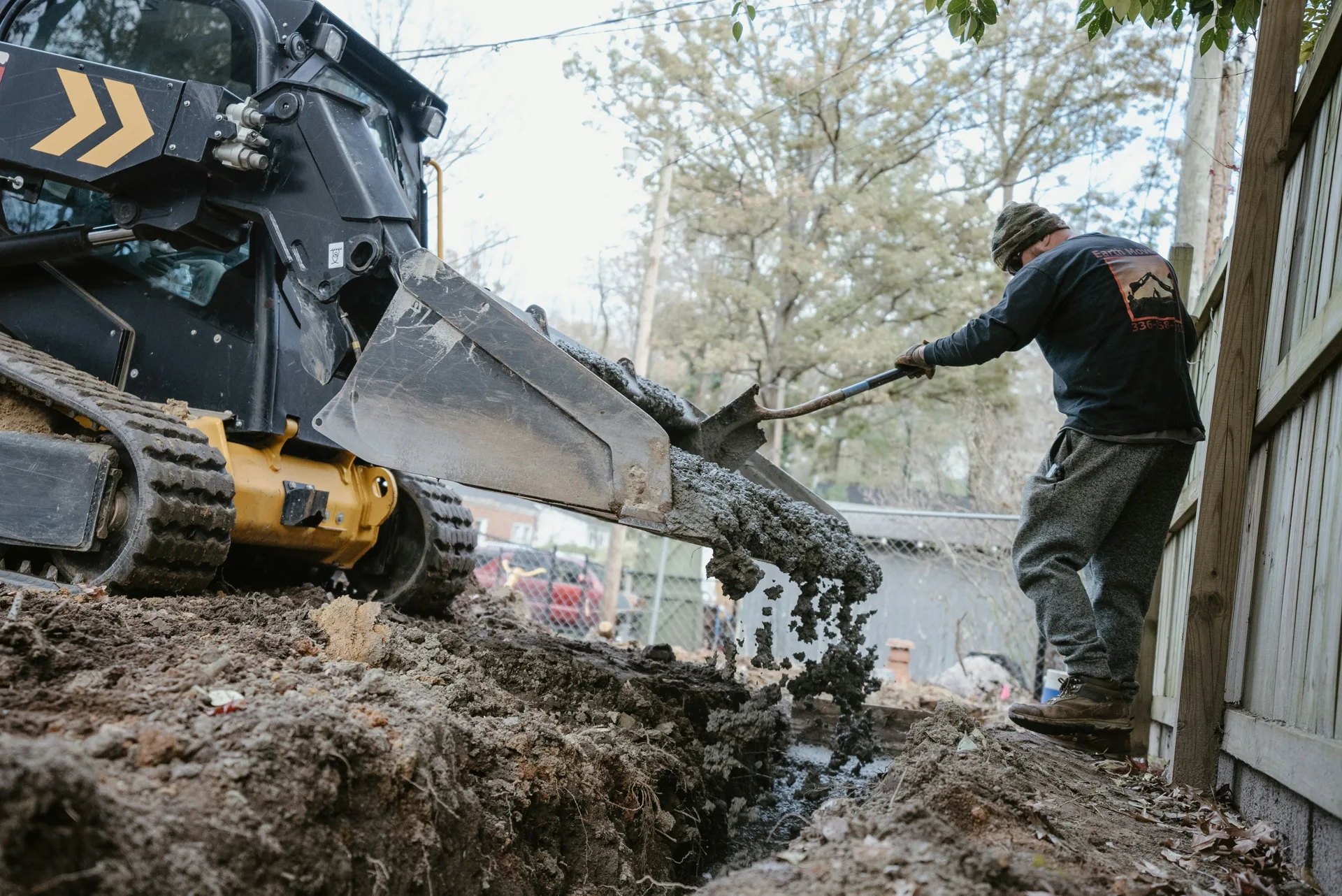 concrete foundation footing pour with a skid steer at a Las Vegas site