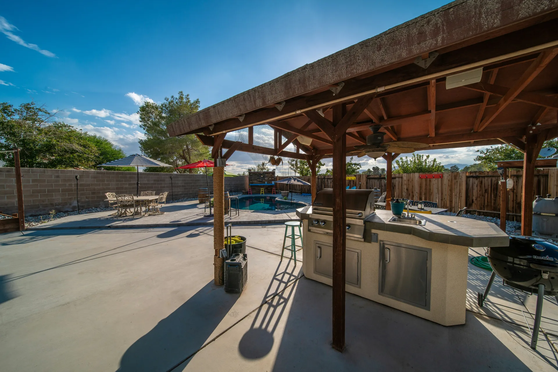 broom-finish concrete pad around a fire pit at a Las Vegas home