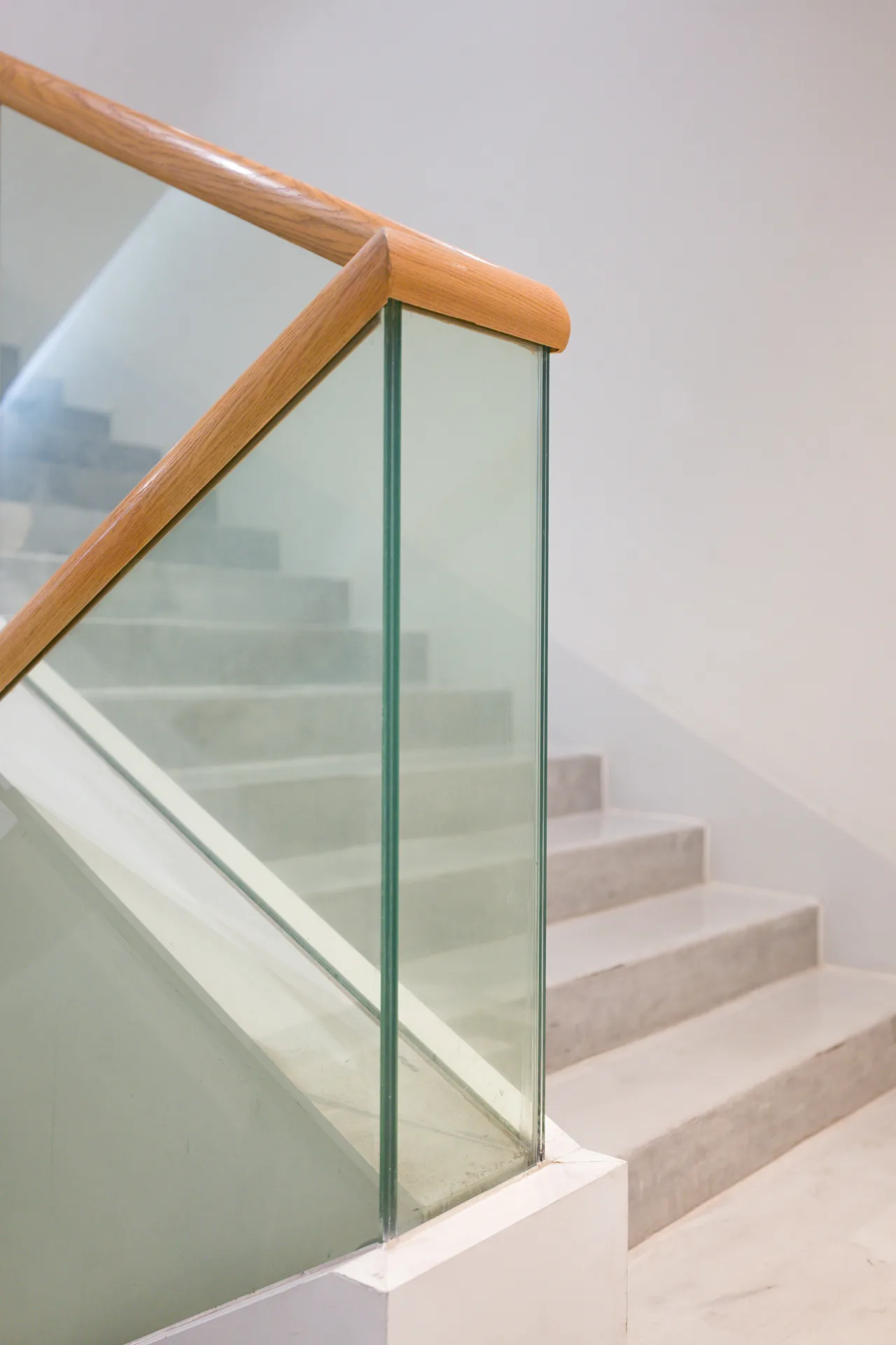 poured concrete staircase with glass railing at a Las Vegas home